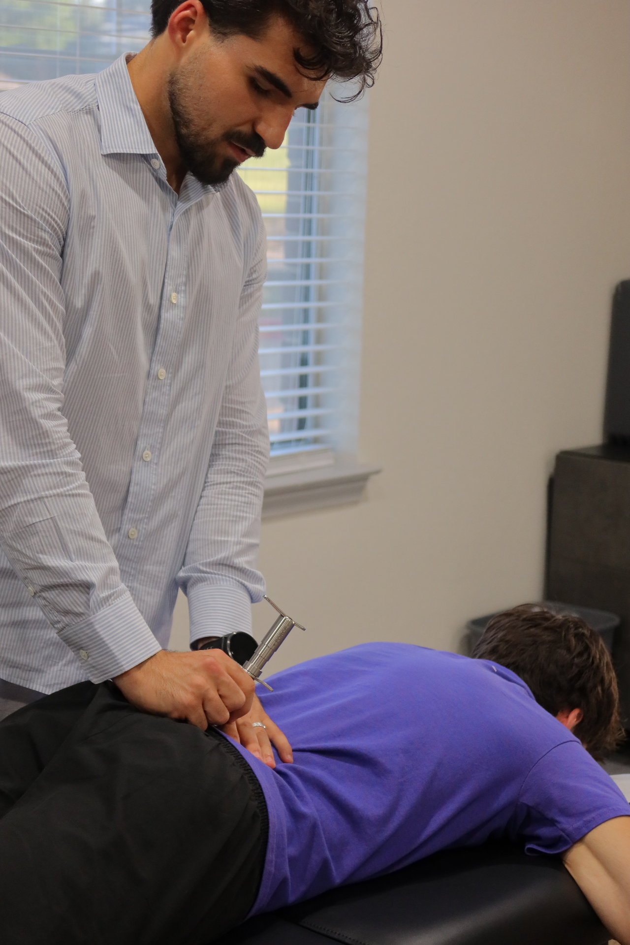 Dr. Rifati delivering a gentle Torque Release adjustment with the Integrator